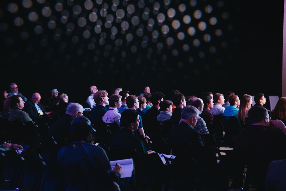 An audience attending a professional conference presentation