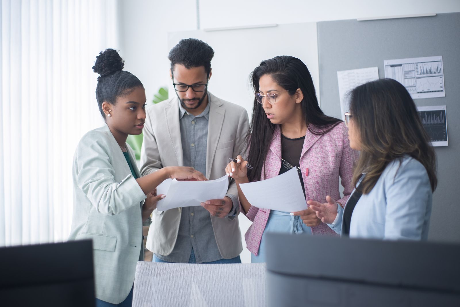 A diverse professional team discussing partnership plans